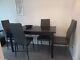 Black Dining Table + 4 Grey Cushioned Chairs Set