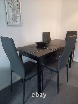 Black Dining table + 4 Grey Cushioned Chairs Set