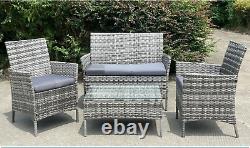 Ensemble de meubles de jardin en rotin gris avec coussin, table basse, chaise, canapé, patio extérieur.