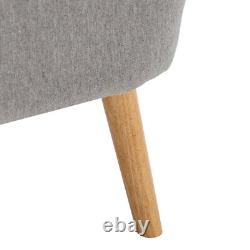 Fauteuil à oreilles rembourré en lin gris clair avec repose-pieds et coussin